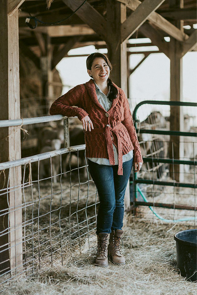 Christina Danaee is designing her current Appalachian Knits project with wool from Bovidae Farm (in background) in Mars Hill. photo by Olive &amp; West Photography
