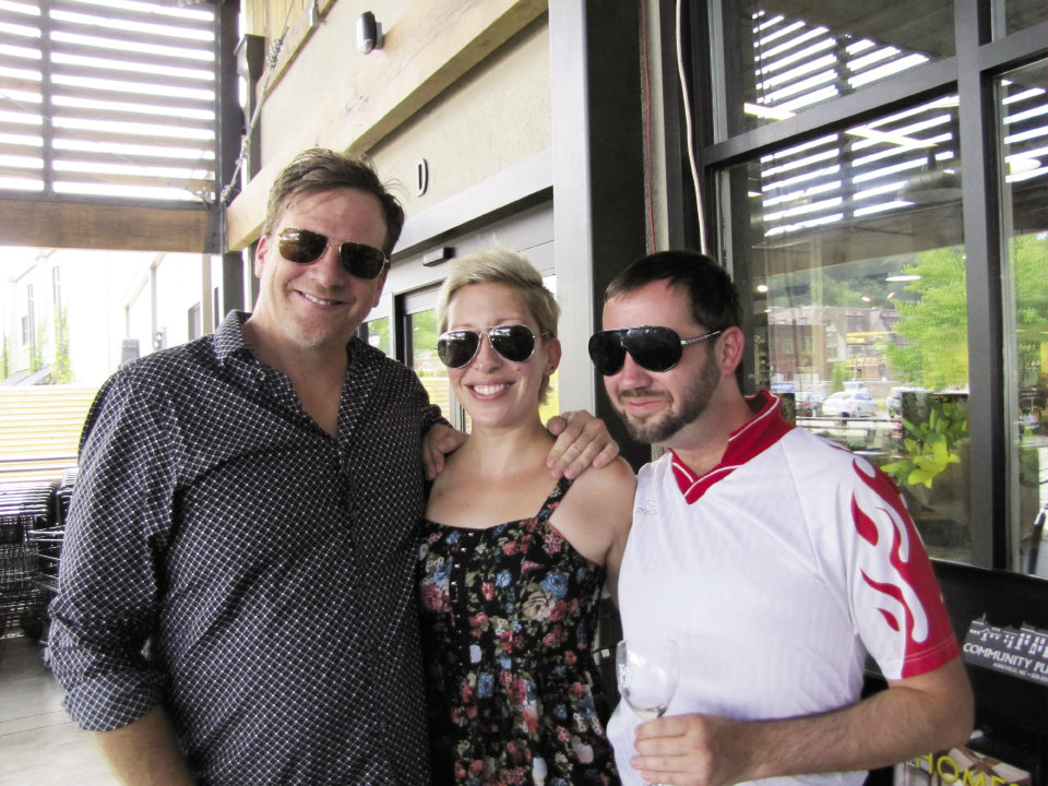 Asheville Grit’s Ayana Dusenberry with Doug Hecker (left) and Chris Bubenik