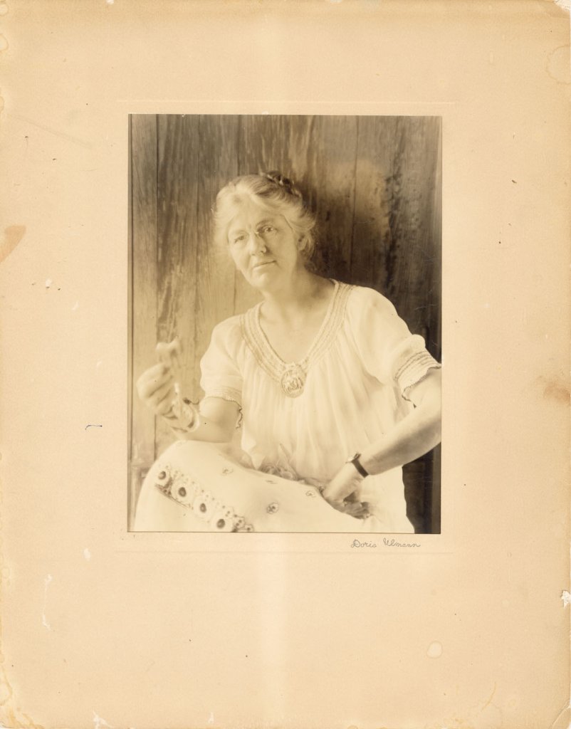 Olive Dame Campbell (holding a wood carving) named the school after her husband, who passed away before their dream could come to fruition.