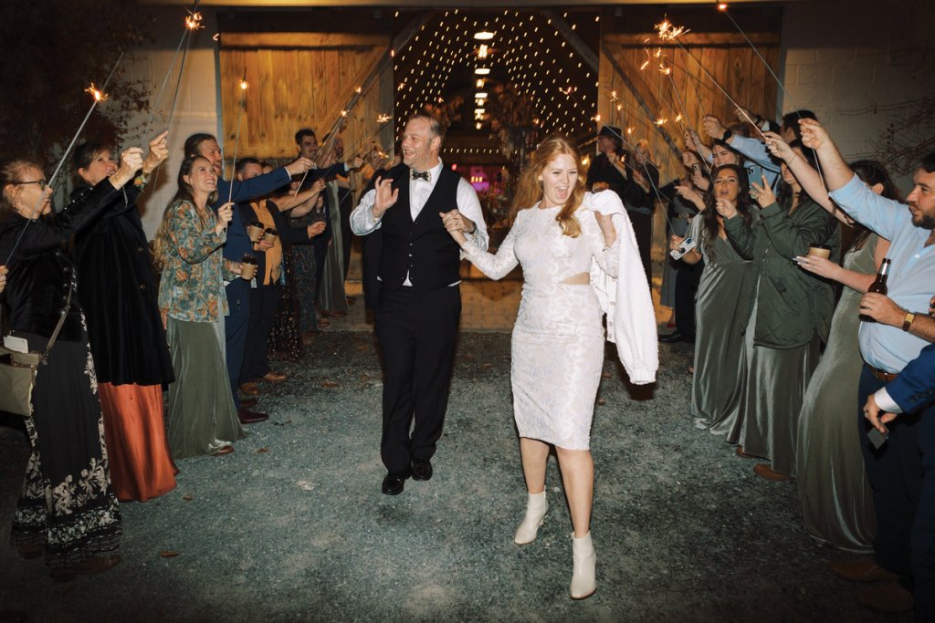 The bride and groom make a striking exit with the traditional sparkler fanfare.