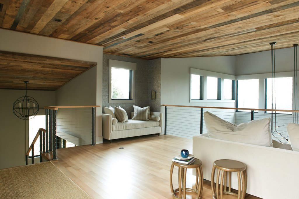 The loft above the living room is furnished with large couches big enough for the Glaubitz’s grandchildren to sleep on when visiting.