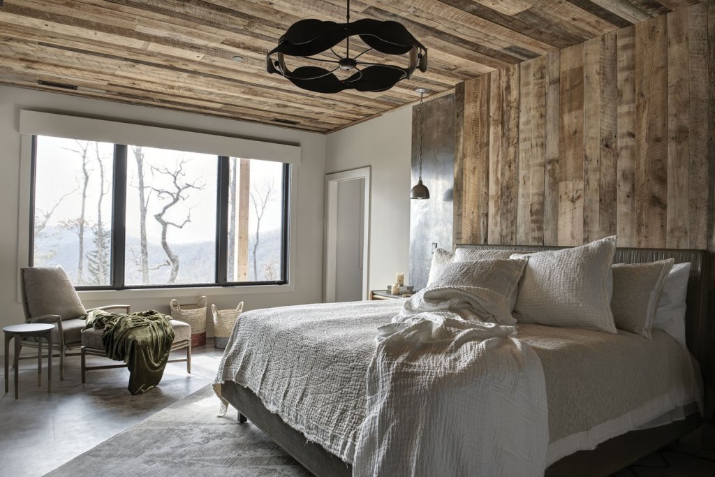 The bedrooms use oatmeal and white fabrics to create a calming feel, while large windows let in plenty of natural light.