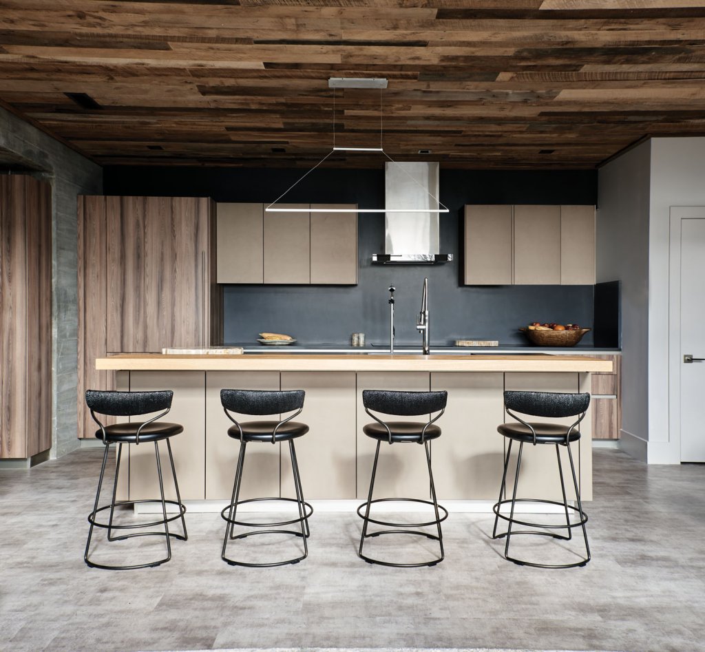 The kitchen highlights the natural finishes that flow throughout the house.