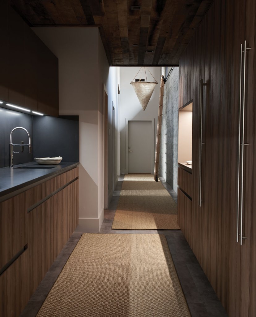 The lighter wooden hues complement the gray walls and furnishings.