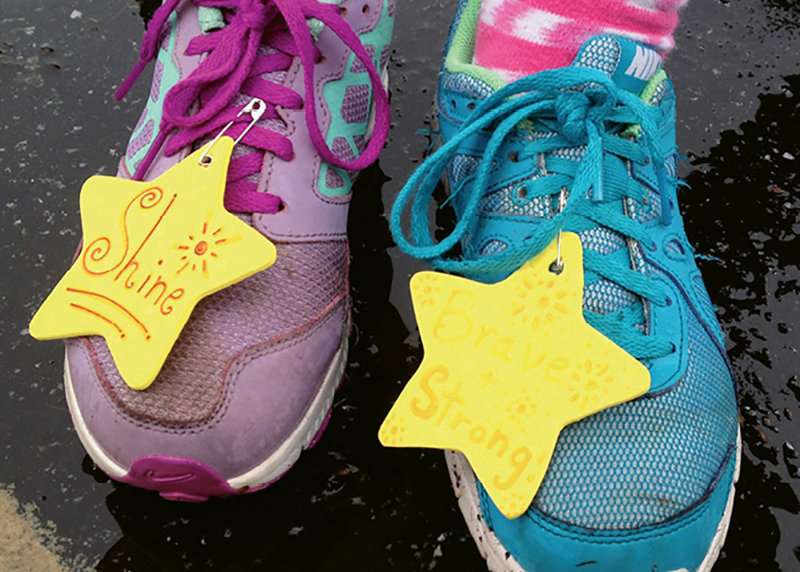 Runners received inspiring shoe tags from the sisters of Gamma Phi Beta at UNCA.