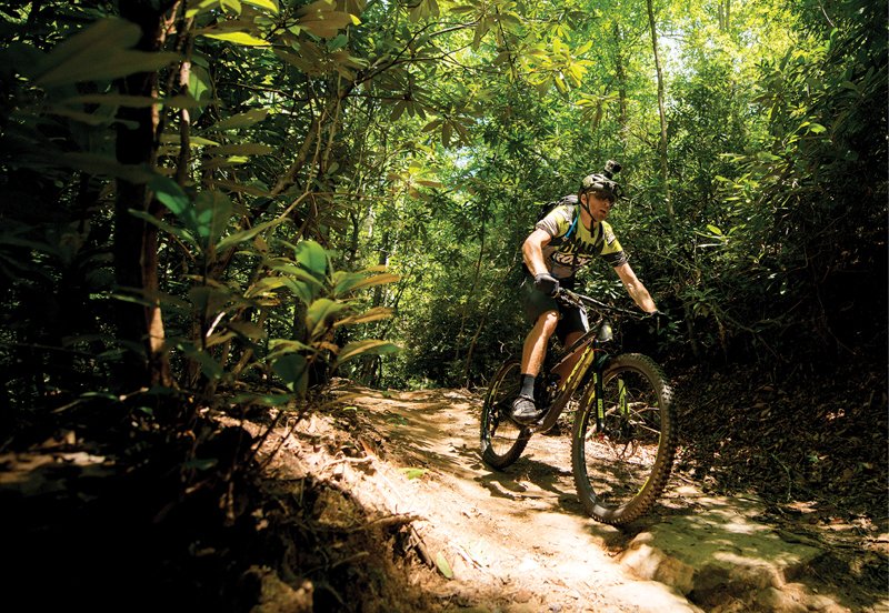 Aron Smith mountain bikes through the Pisgah National Forest