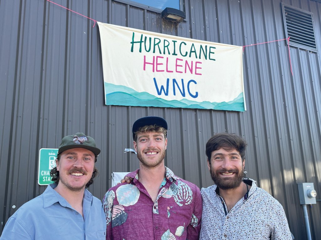 From left to right: Cooper Leist, Lance Buskey, and Sam Iatarola, cofounders of Helene Rebuild Collaborative, in front of their warehouse space.