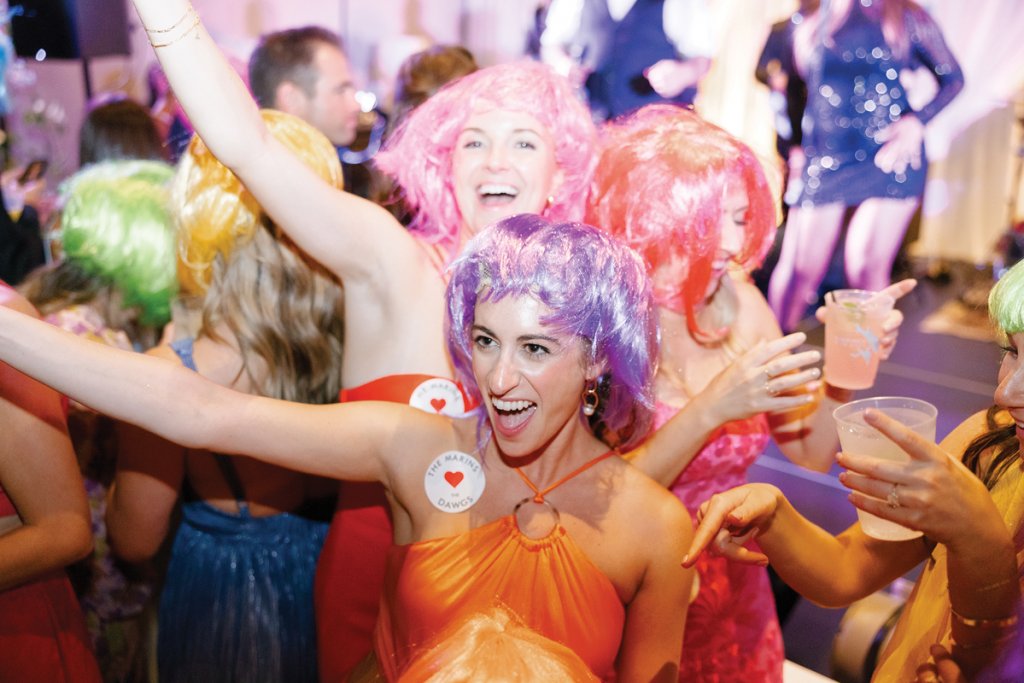 Rainbow-haired guests dance the night away.