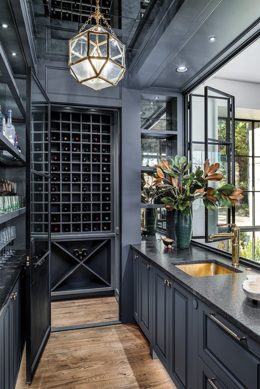 A wine room hides behind a steel door in the bar area.