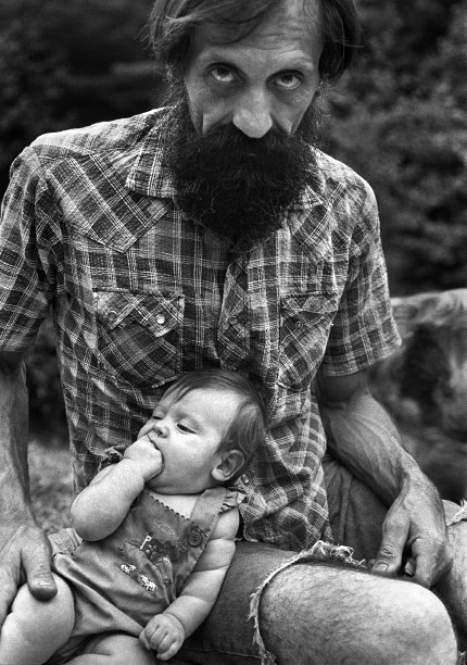 Lionell Filiss and his daughter, Jemima, Big Pine (1983) Lionell and his wife Mary moved to the Big Laurel community in the early 1970s. They were native New Yorkers, college-educated, who came to Madison by way of Berkeley, California, and Central America. They raised a large family, birthing most of the children in their small cabin.