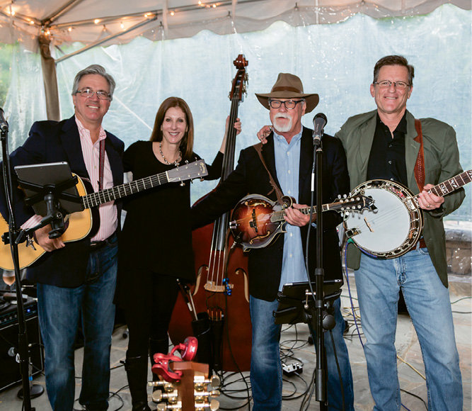 Wellstrung bluegrass band entertained guests during Stock Your Cellars tasting and market.
