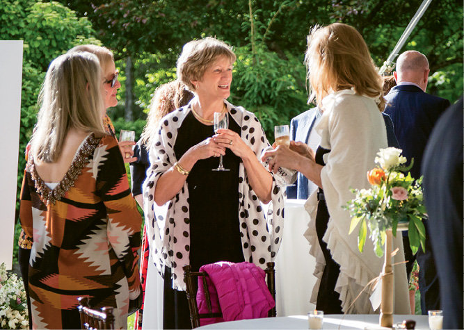 Elizabeth Fletcher and friends mingled during one of 12 winemaker dinners on Thursday.