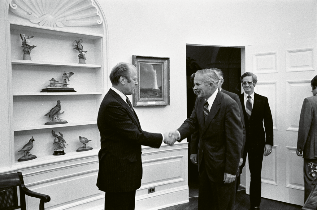 Duckett, who usually avoided the limelight, was photographed at the White House (below) while receiving an award from President Ford in 1974.