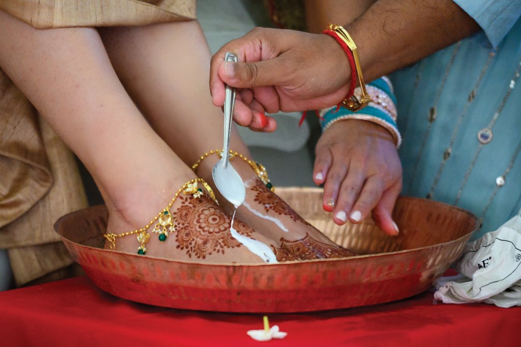 The washing of feet in milk and honey honors their new life ahead.