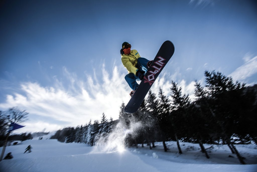 A snowboarder soars at Beech Mountain Resort. Photograph by Randy Johnson.
