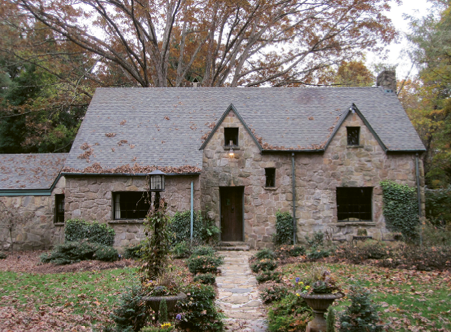 The 1920s fieldstone house, which butts up to the North Carolina Arboretum property and miles of wooded trails, received a face-lift with the addition of a covered entry that blends with the era of the home.