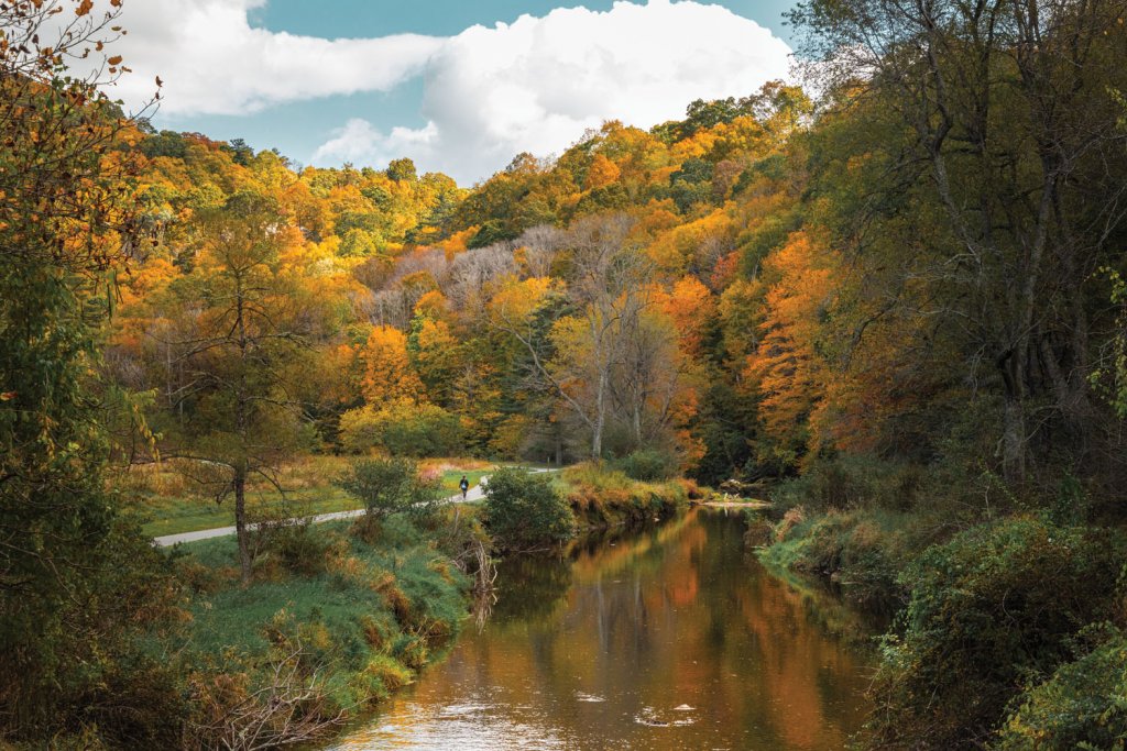 The path in Greenway Park connects urban spaces with the natural landscape of the Blue Ridge Mountains.