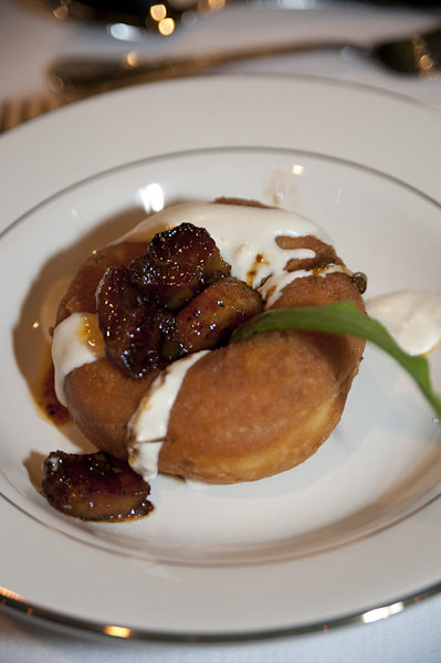Savory donut with sweet potato, cheese, candied hog jowl, and chicory prepared by team Knife &amp; Fork.