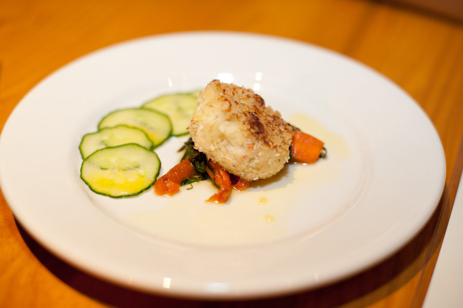 Chef French&#039;s carrot and fennel crab cake over roasted carrot salad with citrus cucumber and carrot oil