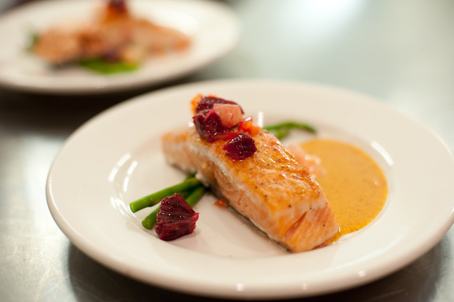 Moore&#039;s duck fat Celtic sea salt seared salmon with gingered carrot butter sauce, citrus chili and pickled carrot relish and asparagus