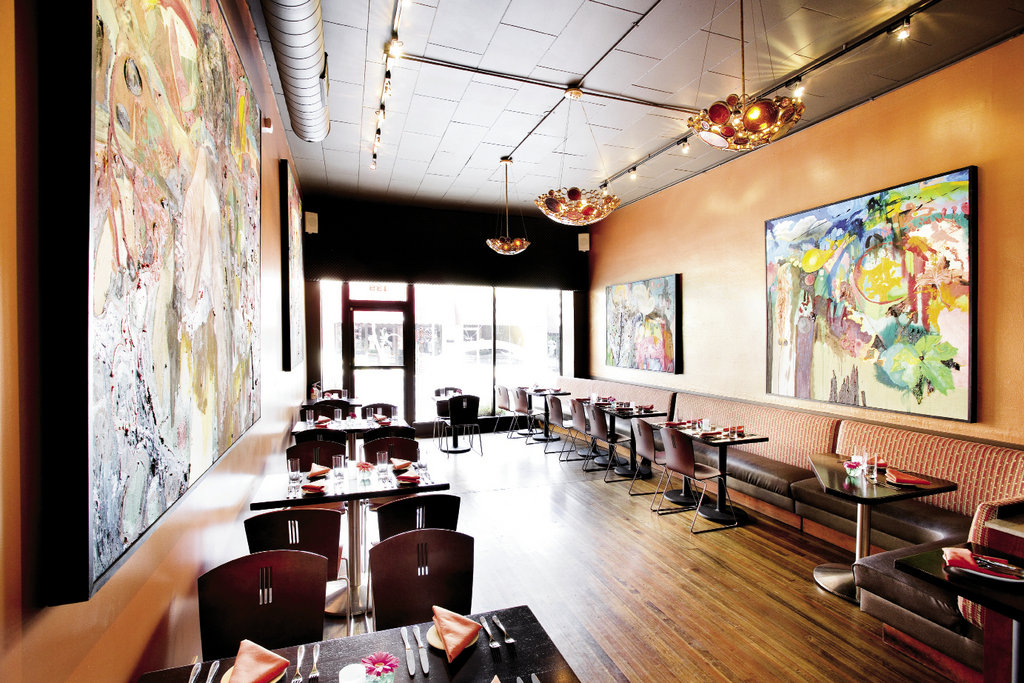 In the dining room, cinnamon walls are adorned with paintings by Hickory artist Dan Smith.