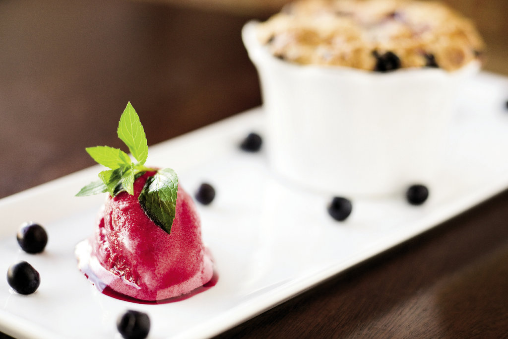 the rotating lineup of desserts, including the mixed berry slump served with sorbet, is created in-house.