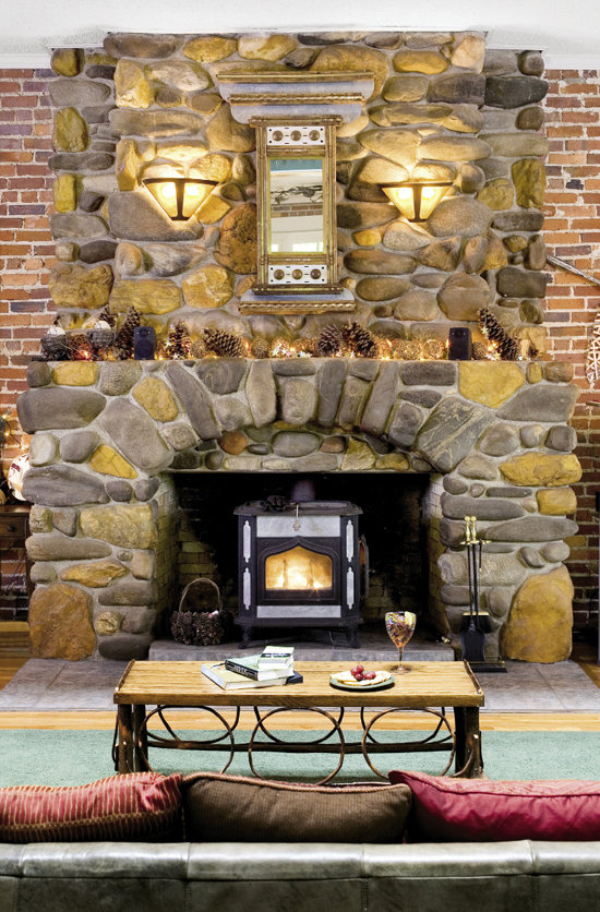 Nancy created room vignettes, including couches circling the stone fireplace, to cozy up the 2,000-square-foot great room.