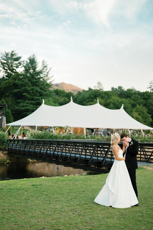 Elizabeth and Robert share a private moment in front of the bridge that the wedding party took to the altar.