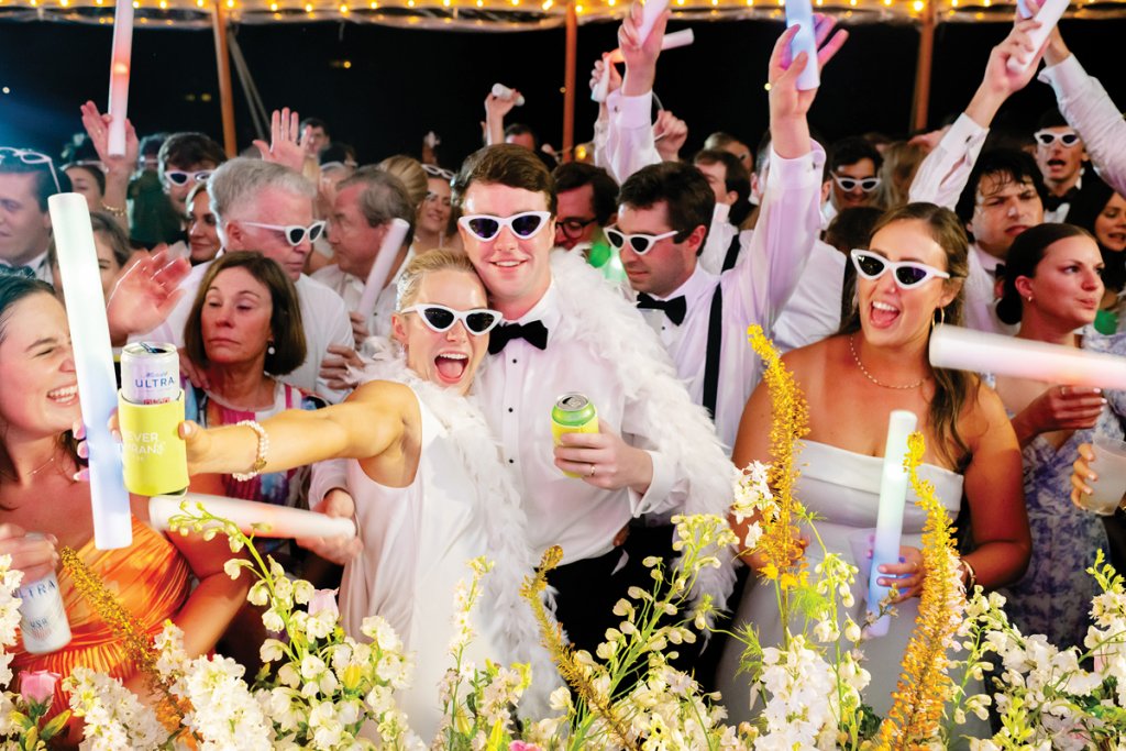 Funky sunglasses and light-up foam sticks liven up the reception.