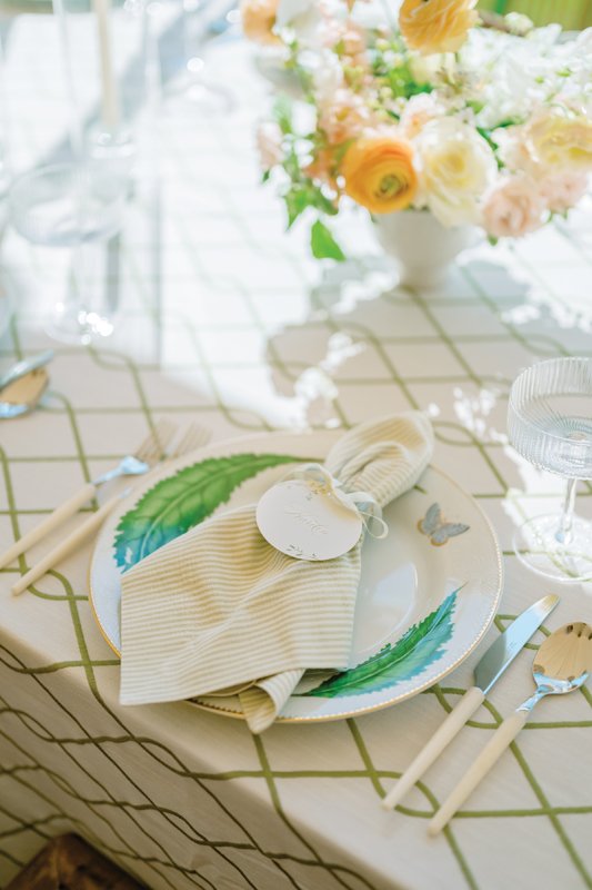 Mixing patterns for the table linens kept the coastal blue color scheme feel fresh and fun, not overthought.