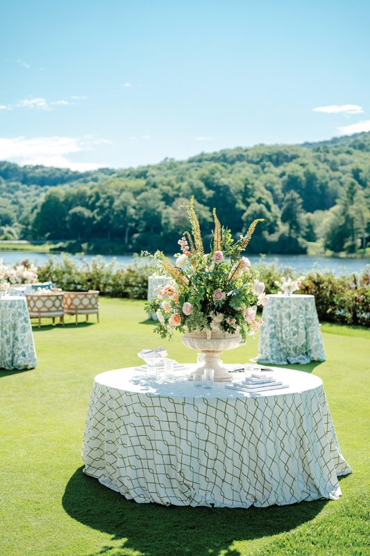 Butterflies and accents of greenery are placed throughout the wedding supplies.