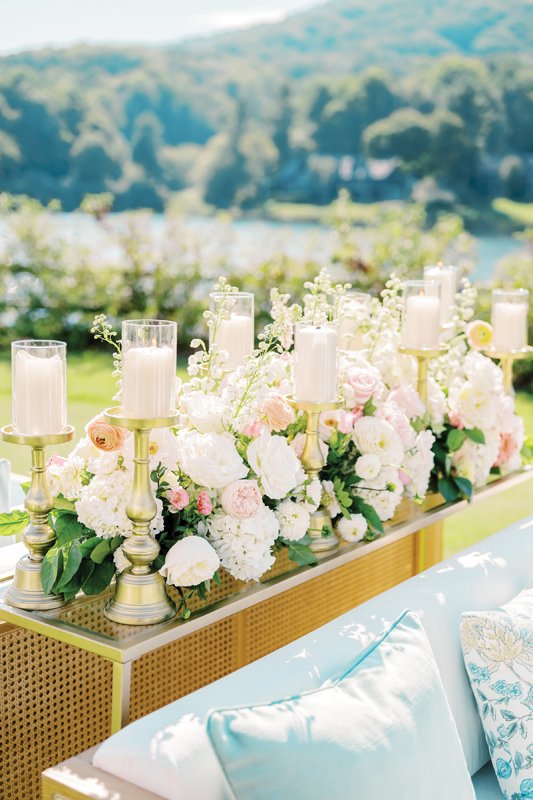 Pastel pink florals complement the baby blue seating.