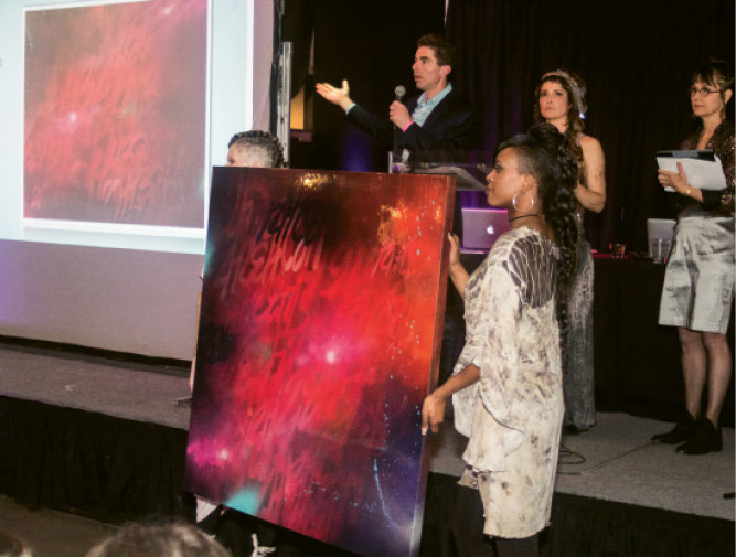 Andrew Brunk auctioned off a painting  donated by Oscar “Trek6” Montes.