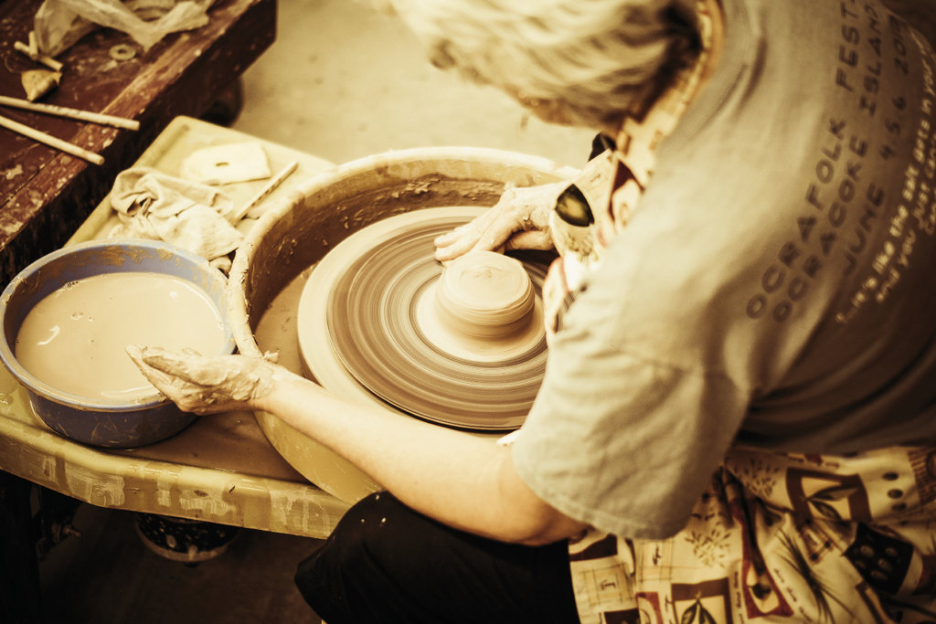 Working the wheel in the pottery studio