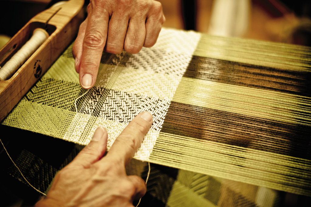 In the weaving studio, advanced students practice twill patterns on the looms.