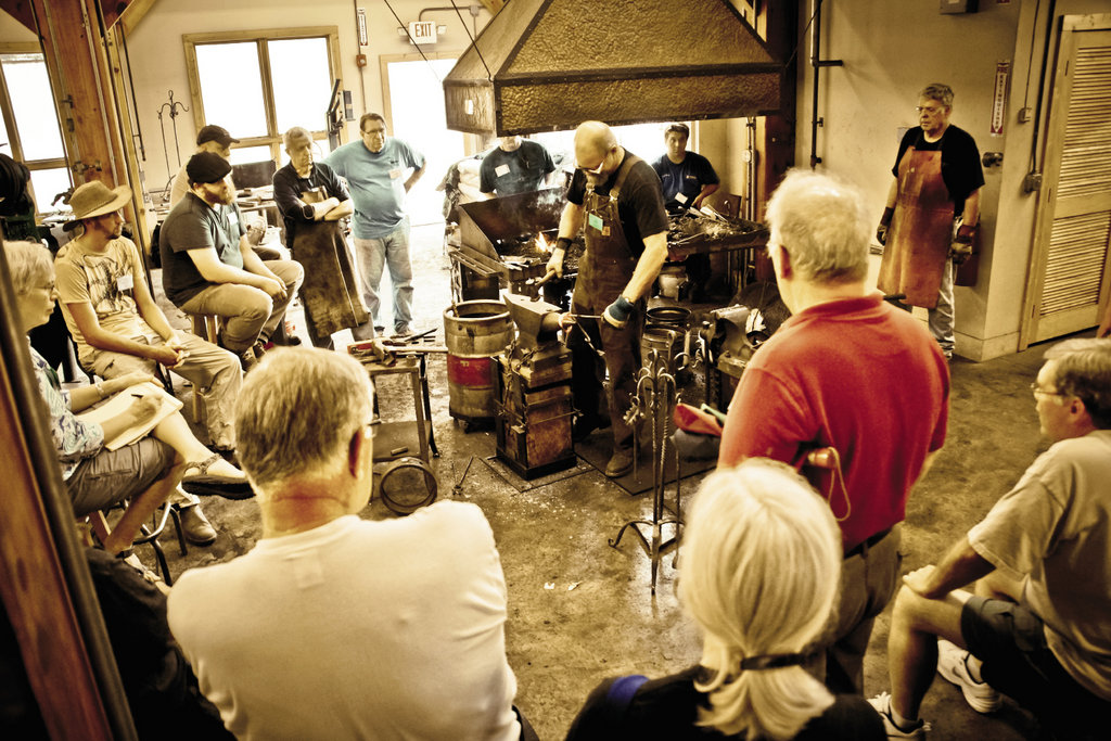 Instructor Jeff Mohr (center) got his start in blacksmithing as a student at the school 30 years ago.  In his Home and Hearth course, he shares forging techniques for making fireplace accessories, gates, furniture, and more.