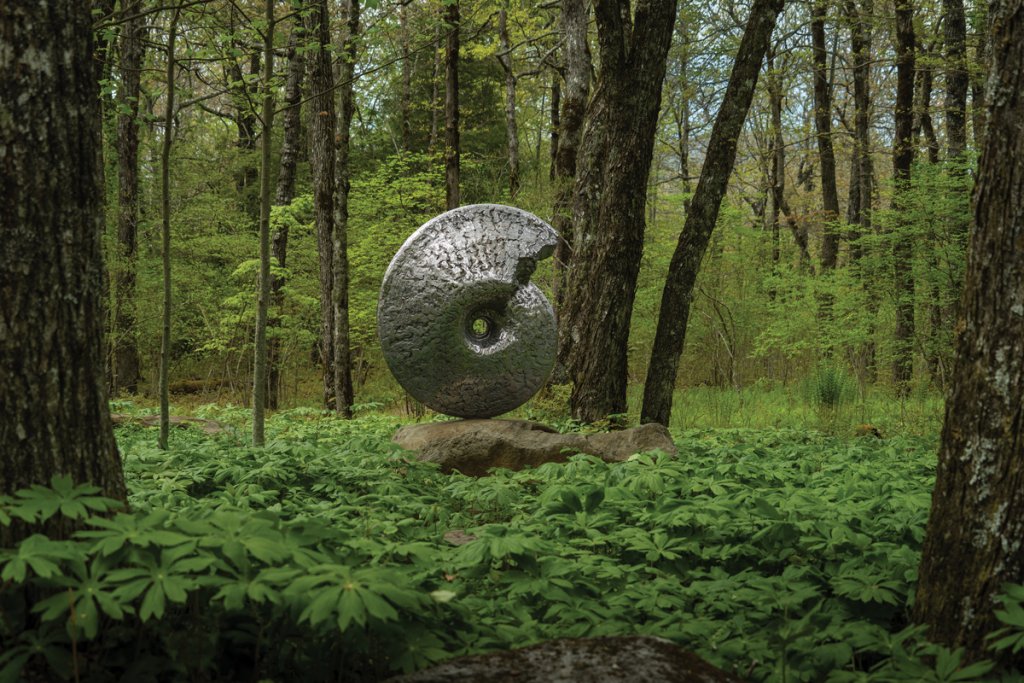 A Cretaceous ammonite sits on display.