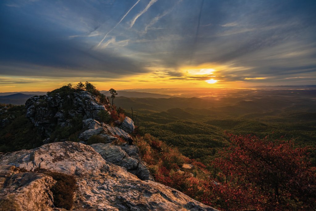 Light show: A stunning sunrise steals the scene at the always gorgeous vantage from the Chimneys in Linville Gorge Wilderness