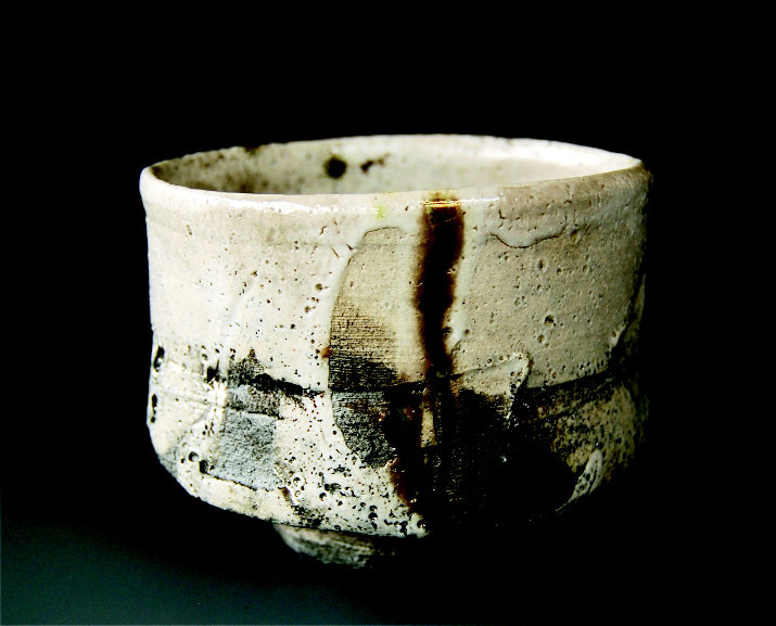 Many pieces, including the wood-fired chawan tea bowl, are thrown off center to give them an organic, hand-built quality.