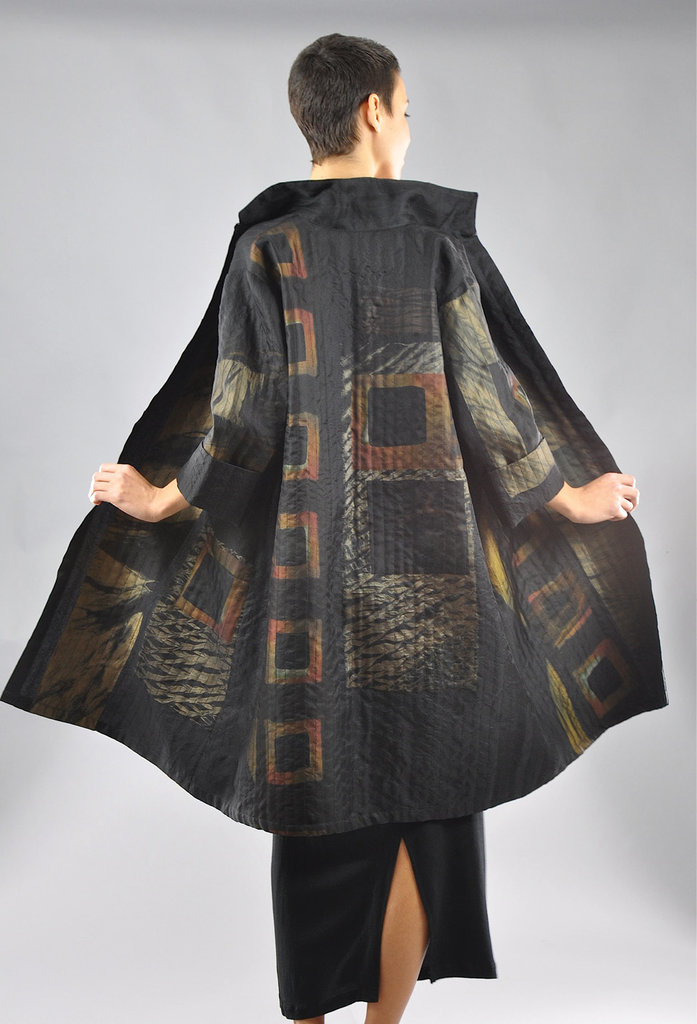 A multilayered swing coat features silk shibori pieces and channel stitching.