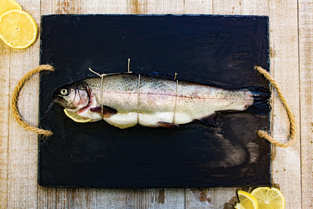 Trout can be used in a variety of dishes, including a whole stuffed trout with apple.