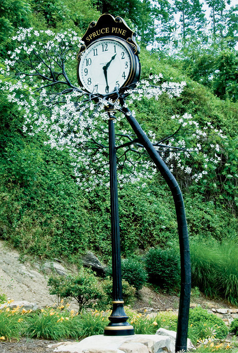 Branching Out - Residents of Spruce Pine helped Brim complete the Sarviceberry Tree clock, along with its blossoms and branches, that stands in downtown.