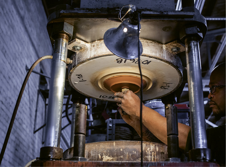 Though the increase in output required a departure from hand-throwing on a wheel, each piece produced still goes through many hands with the aid of modern machinery.