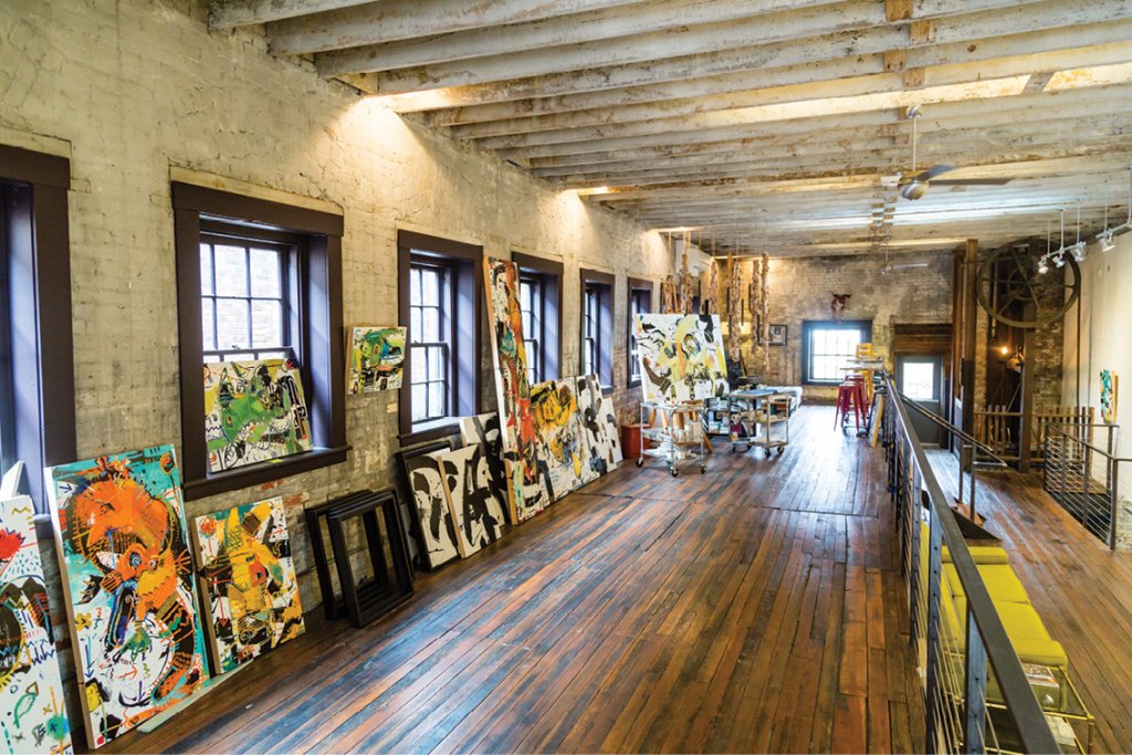 In the RAD, nearly two dozen industrial warehouses have become studios for more than 200 artists. (Left) The Lift Studios, where Daniel McClendon paints and shows his works.