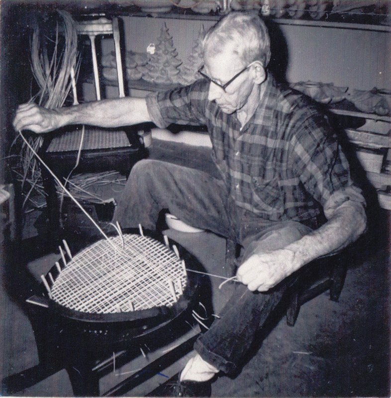 Clements’s grandfather Hobert weaves a laced cane chair at his home in the Blue Ridge Mountains.
