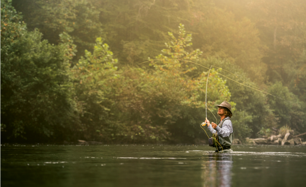 Brett Meany, a guide with Headwaters Outfitters, fishes a stretch of the French Broad River near its origin in Transylvania County.