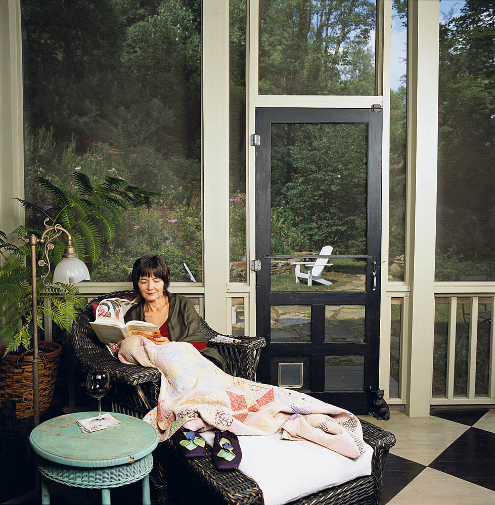 Quiet Respite: Long relaxes on her screened porch, which opens to a stone path and back garden.