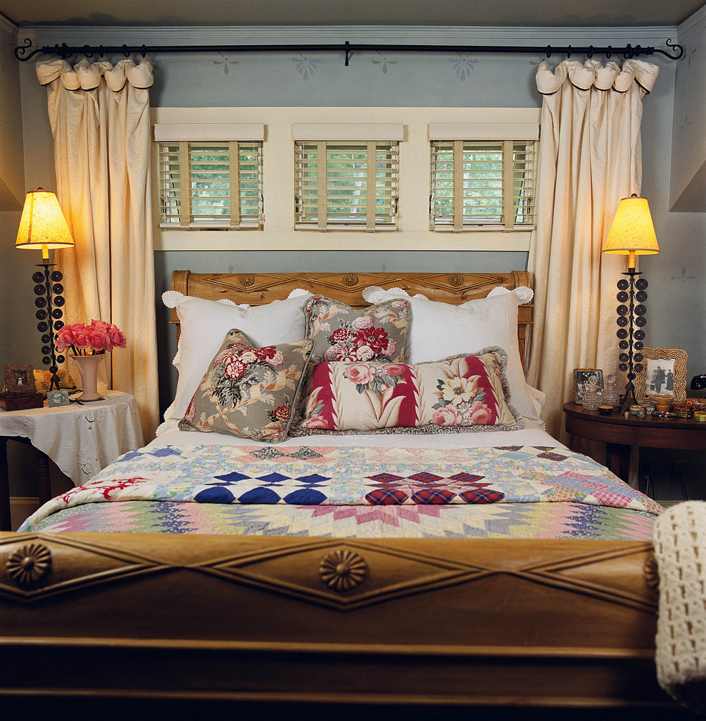 A trio of awning windows line the space above Long’s bed, with washed cotton damask curtains flanking either side. The bed is crafted from Indonesian wood and dubbed the “Paris Bed.”