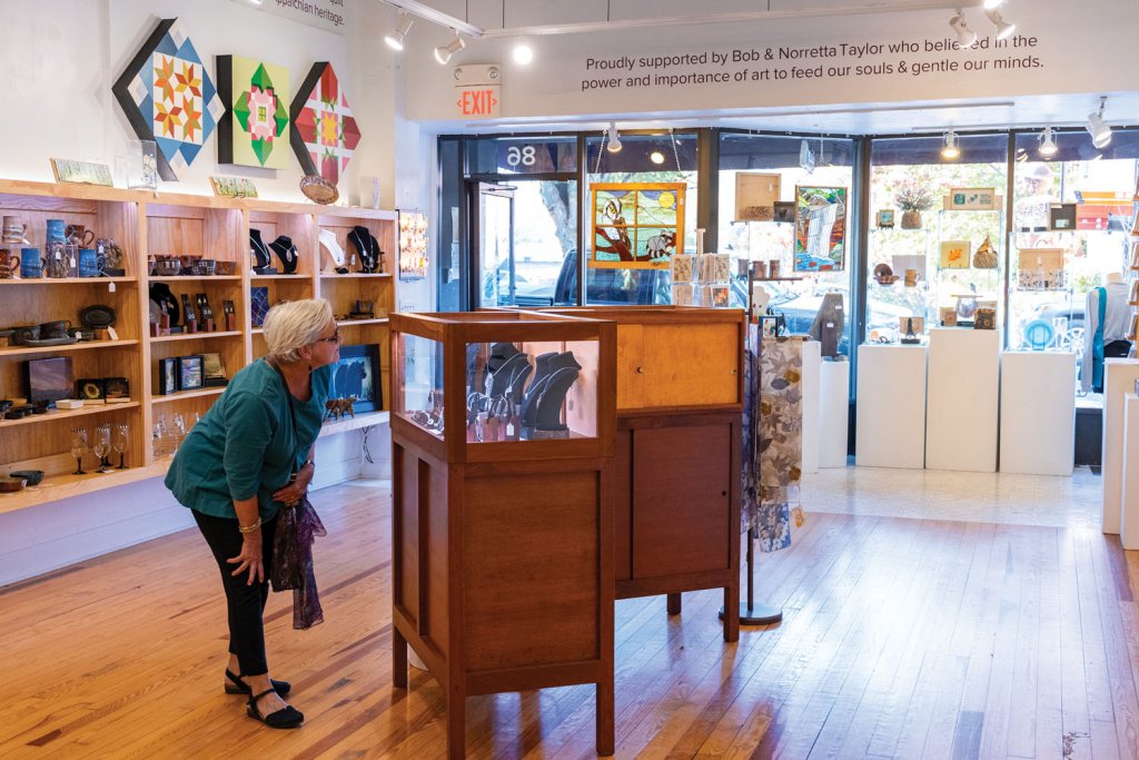 a patron peruses Haywood County Arts Council. Courtesy of Visit Haywood.