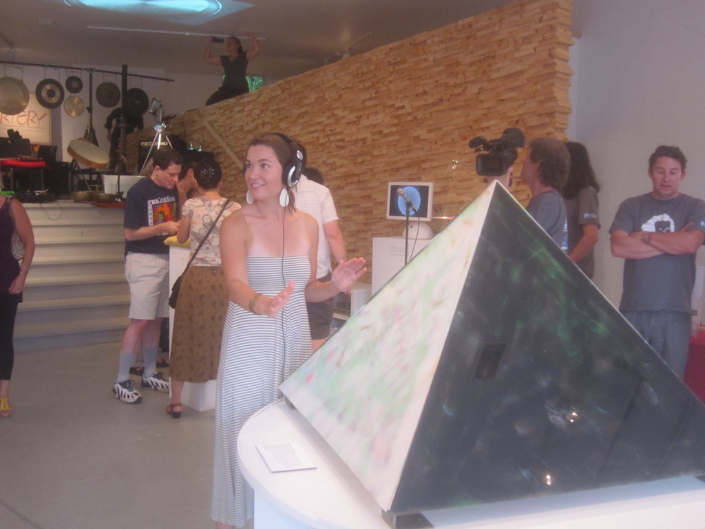 Bridget Elmer tries out Gabriel Shaffer&#039;s interactive pyramid installation
